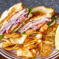 Turkey Club Sandwich · Turkey, Ham & Bacon with Lettuce, Tomato, and Onion. Served with your choice of Homemade Pot...