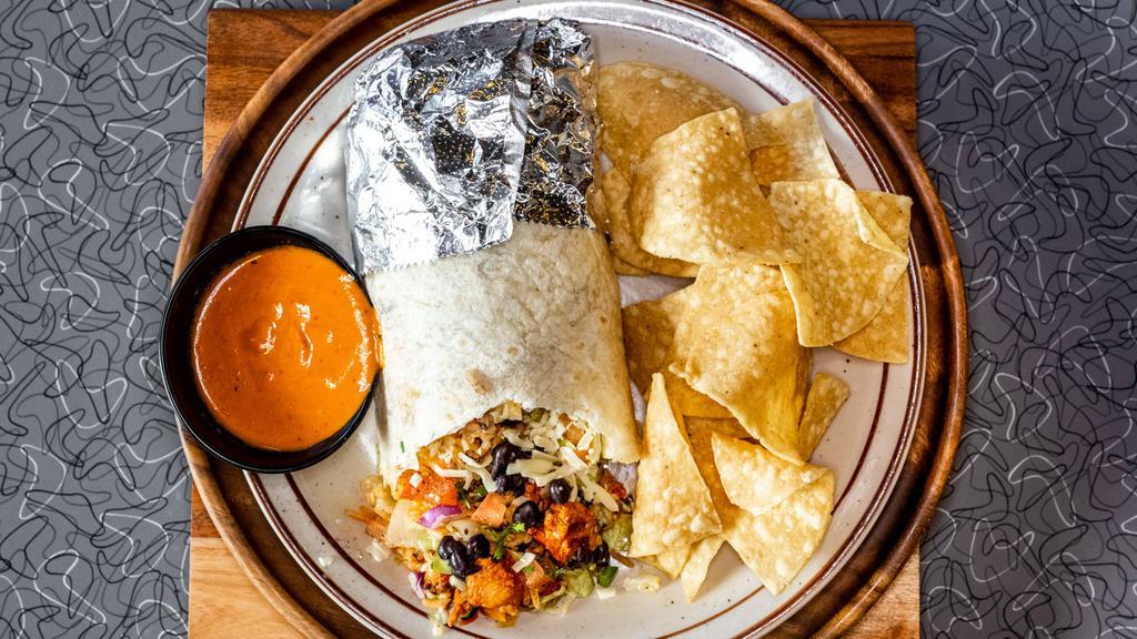 Burrito · A large flour tortilla filled with your choice of protein topped with Lettuce, Pico de Gallo, Sour Cream, and Chihuahua Cheese. Served with Chips & Salsa.