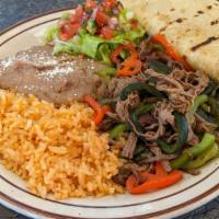 Machaca (House Specialty) · Braised and shredded beef refried with bell peppers, onions, and poblanos. Served with house...