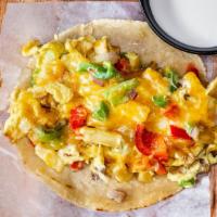 Breakfast Taco · A breakfast style taco with a eggs scrambled together with Andy's Potatoes and you choice of...