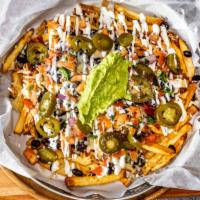 Fry-Chos · Freshcut fries topped with melted cheese, beans, pickled jalapenos, pico de gallo, sour crea...