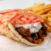Gyro Plate W/ Fries · Two pitas stacked with fresh sliced gyro meat. Topped with authentic tziki sauce, red onions...