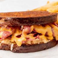 Reuben On Rye W/ Fries · Corned beef served on rye with mozzarella cheese, mustard, thousand island dressing and saue...