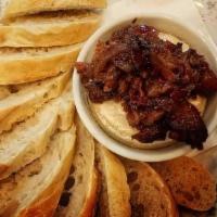 Baked Brie · Brie baked to perfection with your choice of our popular candied bacon, blueberry or house-m...