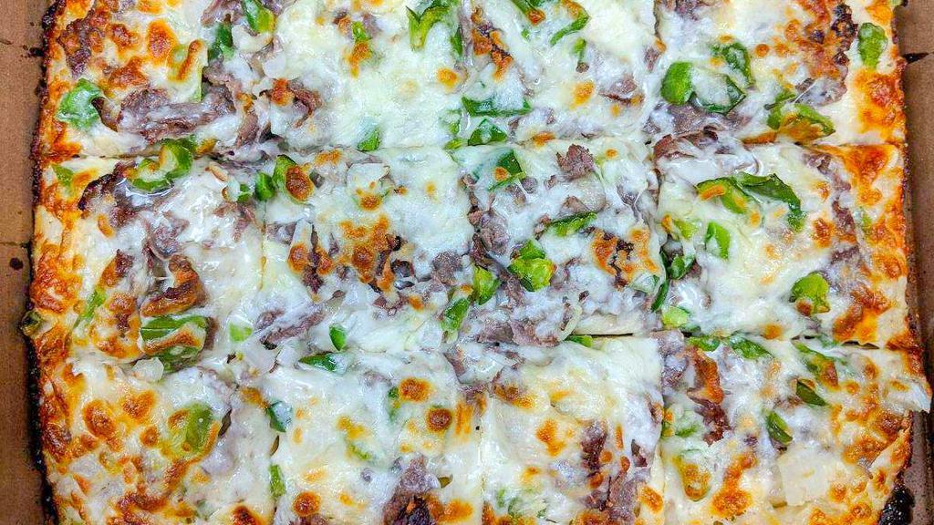 Philly Steak Pizza Round · Philly steak, green peppers & onions with a Cajun crust.