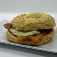 Brunch With Egg - Yolks On You Sandwich · Fried egg paired with honey roasted ham or applewood smoked bacon, cheddar cheese and an app...