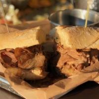 Ribeye French Dip (To Go) · Thins shaved house roasted beef with caramelized onion, Swiss cheese and au jus.  Served on ...