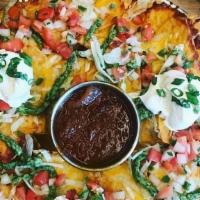 Large Nachos To Go · Melted cheese blend, lettuce, pico de gallo, avocado chimichurri, and choice of chili or gar...