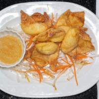 Coconut Wontons · Vegetarian. Sweet coconut cream cheese wonton served with pineapple dipping sauce.