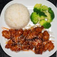 Sesame Chicken · Crispy chicken tossed in a tasty tangy sesame sauce topped with sesame seeds and served with...