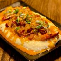 Shrimp And Grits · Creamy polenta, cajun spiced shrimp, sausage, scallions