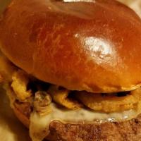 Wild West Burger · Spicy. A quarter pound burger served on a seeded bun with BBQ sauce, chipotle sauce, America...