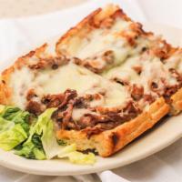Godfather Sandwich · Roasted Italian beef and melted Mozzarella served on garlic bread.