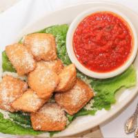 Ravioli · Handmade pasta pillows With spinach, veal, eggs and Parmesan Cheese in A delicious tomato or...