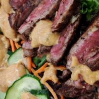 Beef Salad · Iceberg lettuce, spring mix, carrots, and choice steak served with sumo salad dressing. chic...