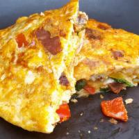 Mexican Omelette* · Chorizo sausage, red onions, tomatoes, jalapenos, mozzarella cheese, topped with salsa.