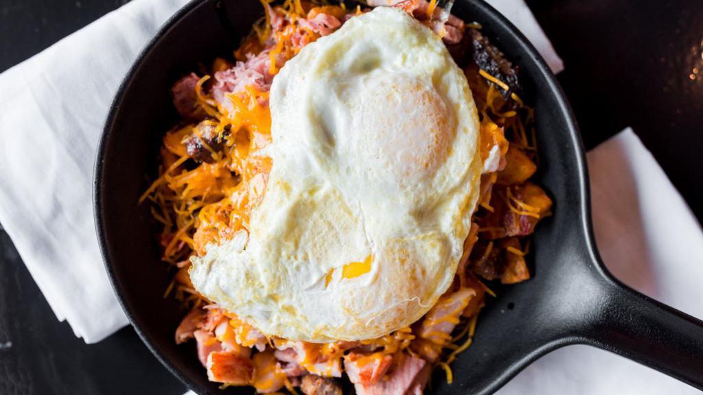 Maine Street Meat Lovers Skillet · Corned beef, bacon, sausage and ham topped with cheddar.