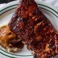 Bbq Ribs · Tender meaty ribs slow-roasted and slathered with our sweet and spicy barbecue sauce. Served...