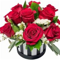 Red Roses, White Statis, & Eucalyptus Flower Box · A flower box featuring 12 red roses, white statis, and eucalyptus.