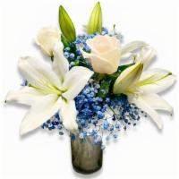White Lilies, Roses, & Blue Baby'S Breath In A Vase · 3 Lilies (White), 2 Roses (White), Baby's Breath (Blue), Vase