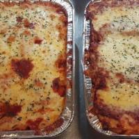Lasagna · Homemade from the family recipe: layers of ribbon noodles & three cheeses,
smothered in mari...