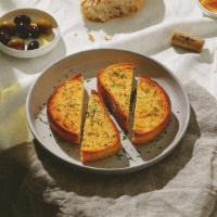 Garlic Bread · Delicious bread coated in hot garlic butter.