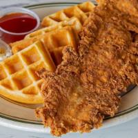 Chicken & Waffles · Deep fried chicken breast on a Belgian waffle with black pepper honey butter and sriracha ho...