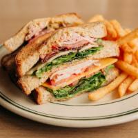 Club · Roasted turkey, ham, sweet pepper bacon, cheddar, swiss, tomato, greens, and dijonnaise on h...