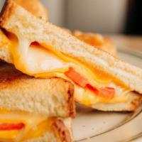 Grilled Cheese · American, cheddar, provolone, and griddled tomato on brioche.