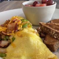 Farmers Omelet · Bacon, ham, green bell peppers, onions, and Cheddar cheese. Three egg omelets served with a ...