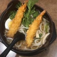 Nabeyaki Udon (In Hot Pot) · White wheat noodles with chicken, fishcake and vegetables in stone pot.