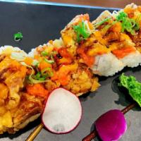 Godzilla Roll · Shrimp tempura, spicy tuna, avocado, cream cheese, topped with spicy tuna, tempura soft shel...