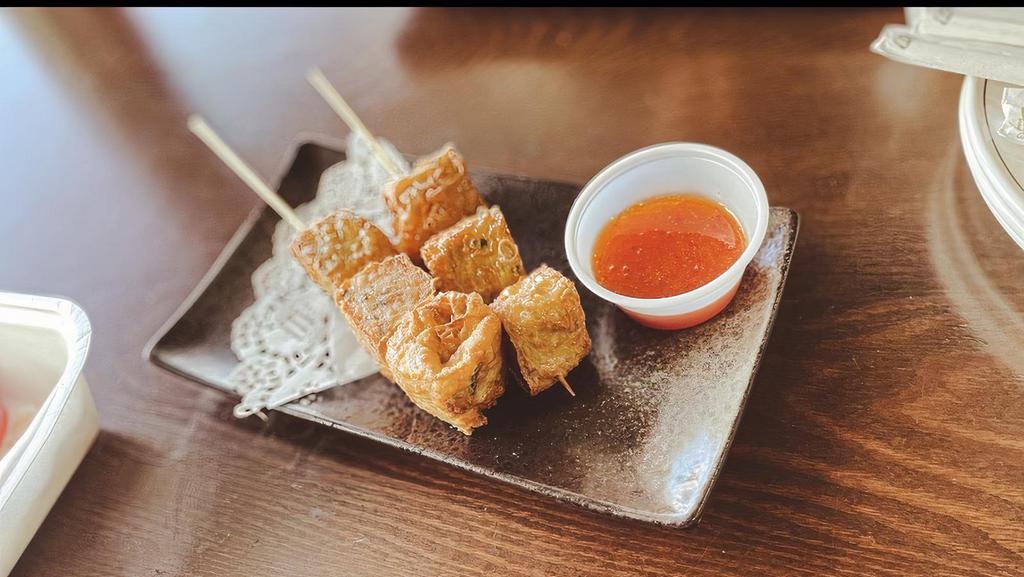Shrimp & Chicken Cake · ground shrimp and chicken, wrap wrap with tofu skin. deep fried, served with sweet chili suace