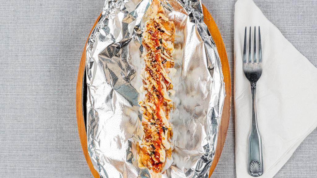 Playboy Roll · Spicy tuna and shrimp tempura topped with boiled shrimp, eel sauce, mayo, sriracha (foil wrap and lit with fire).