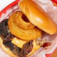 Trek Burger · Topped with beer cheese, bacon and onion ring.