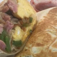 Breakfast Burrito · Eggs, cheese, hash browns, onion, green pepper, choice of ham or bacon or sausage, and salsa...