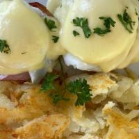 Egg Benedict · English muffin, canadian bacon, and poached egg all topped with gravy and a side of hash.