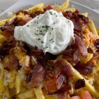 Loaded French Fries · Bacon, cheddar cheese, onion, tomato, sour cream.