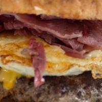 Monster Burger · Corned beef, lettuce, tomato, mayo, onion, pickle, fried egg and a choice of american or swi...