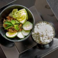 Larb · Herbs, chili's, fish sauce, lime, roasted ground rice, side soup & sticky rice.