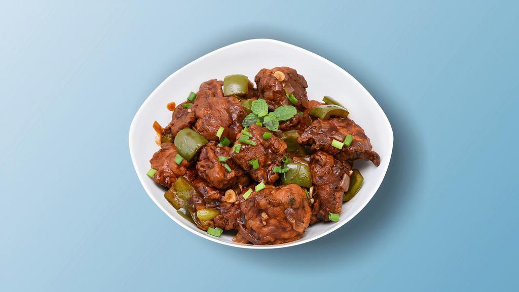 Chicken Manchurian Madness · Chicken morsels, seasoned, batter fried and sauteed with green onions and an Indo-Chinese Manchurian sauce