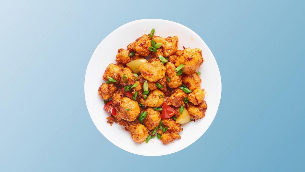 Kung Fu Cauliflower · Cauliflower flowerets  marinated with ginger, garlic, chilies, yogurt,  batter fried and wok tossed with Indo Chinese sauces, garlic and curry leaves