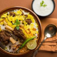 Goat Biryani · Basmati rice cooked in a spiced broth, with fresh veggies topped with cashews, cilantro and ...
