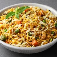 Vegetable Biryani · Basmati rice cooked in a spiced vegetable broth, with fresh veggies topped with cashews and ...
