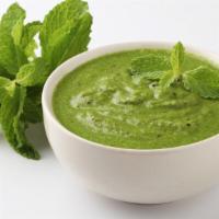 Mint Chutney · Freshly prepared tangy sauce made from fresh mint, cilantro, green chili, and garlic.