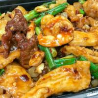 Kung Pao Triple Crown 宫保三鲜 · Spicy. Jumbo shrimp, beef, and chicken stir-fried with peanuts in a spicy sauce.