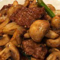 Hong Kong Beef 港式牛肉  · Sliced beef with mushrooms, onions, green onions in a black pepper brown sauces, served on a...