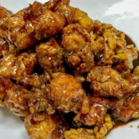 Honey Walnut Chicken 合桃鸡 · Diced chicken sautéed with walnuts and water chestnuts in a special sweet sauce.