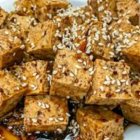 Sesame Tofu 芝麻豆腐 · Spicy. Deep fried tofu with a special sauce and sesame seeds on top.