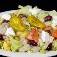 Greek Salad · Iceberg lettuce, tomato, cucumber, feta cheese, pepperoncini and olives.